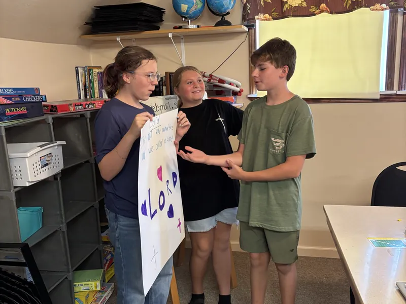 Students holding a banner they made together