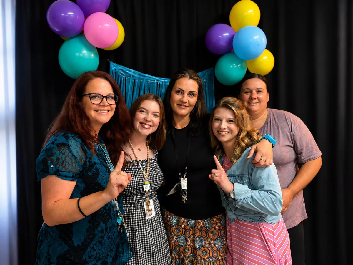 Staff of Star City Christian Academy together at a school event